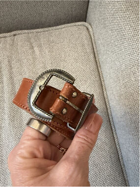 Calderon tan leather belt features a western-style engraved silver buckle